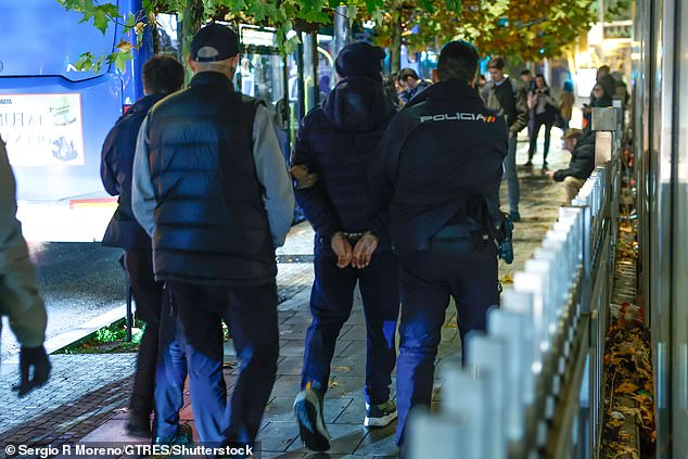 The egg-thrower was led away from the event in the Spanish capital by police and is thought to be due in court on Friday morning