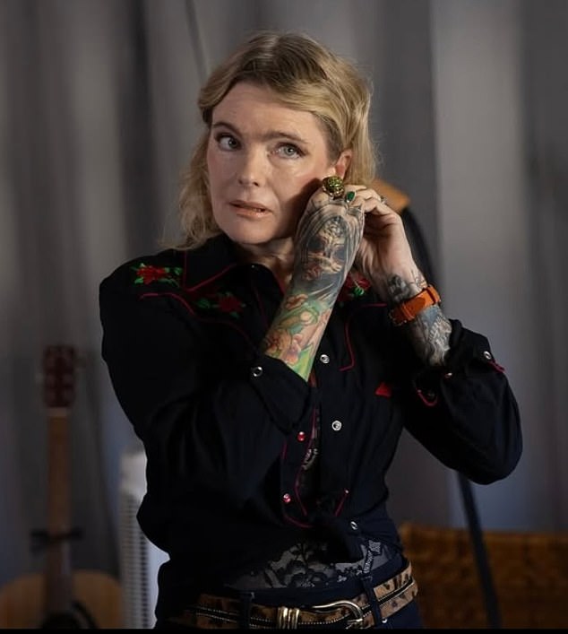 Eleniak seen in a new image from her movie Alchemy In Venice which recently wrapped; the tattoos all over her arms are real