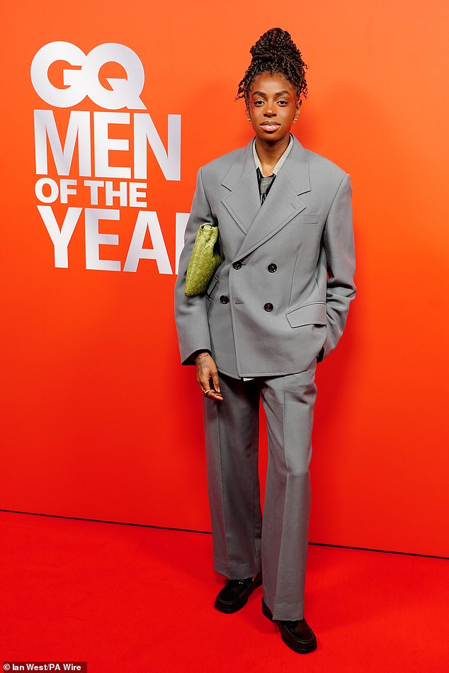 Traitors favourite Cat Burns nailed androgynous chic in a grey double breasted suit and chunky loafers