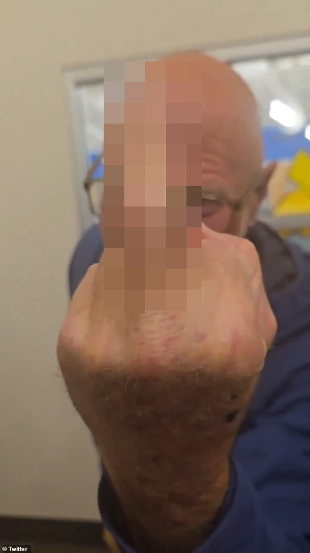 Kozak was seen flipping off the camera recording him as a woman blocked him from supporters of the decision to approve the chapter