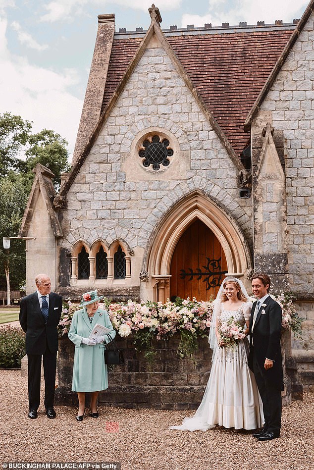 They tied the knot at the Royal Chapel of All Saints at Royal Lodge on July 19, 2020. The couple are seen here with the late Queen Elizabeth and Prince Philip on their wedding day in a handout photo issued by Buckingham Palace