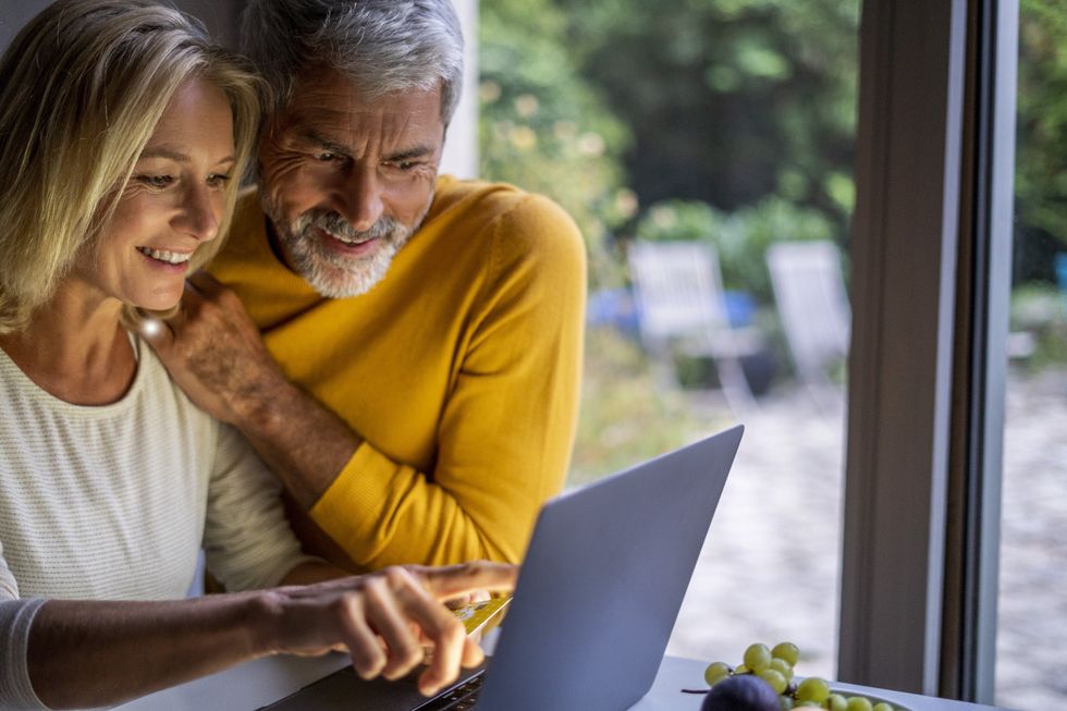 Couple happy at laptop