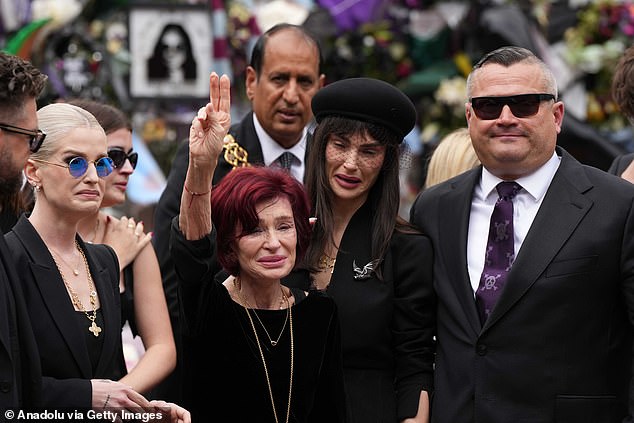 Ozzy's bereft wife Sharon was snapped being consoled by Jack, Aimee, Kelly and Louis as she lay a single red rose for her husband during the procession