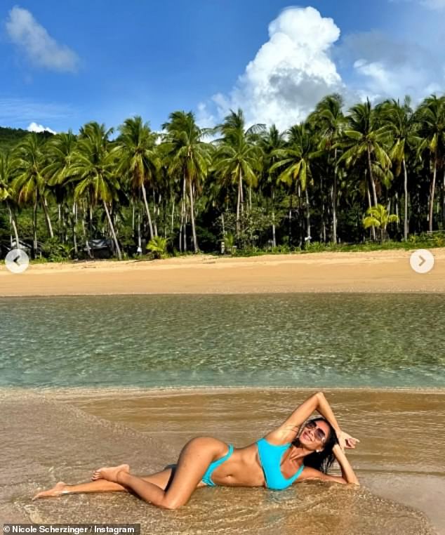 However, in the caption of the post, the actress revealed that she was currently busy on set rather than relaxing at the beach in her happy place