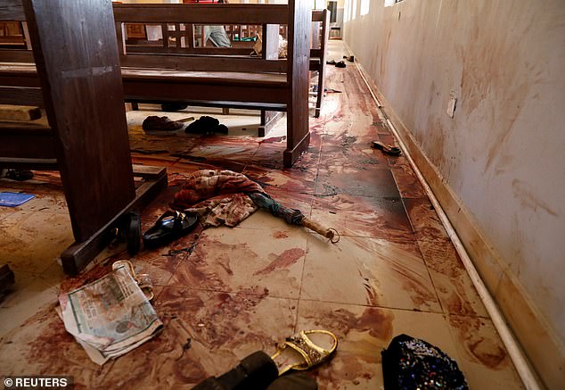 Blood stains and items littered on the ground at a church in Owo, Ondo following an attack on worshippers in June 2022