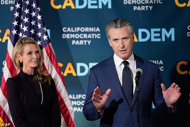 California Governor Gavin Newsom (right) takes a victory lap on election night after a ballot initiative he backed to redistrict the state to favor Democrats overwhelmingly passed