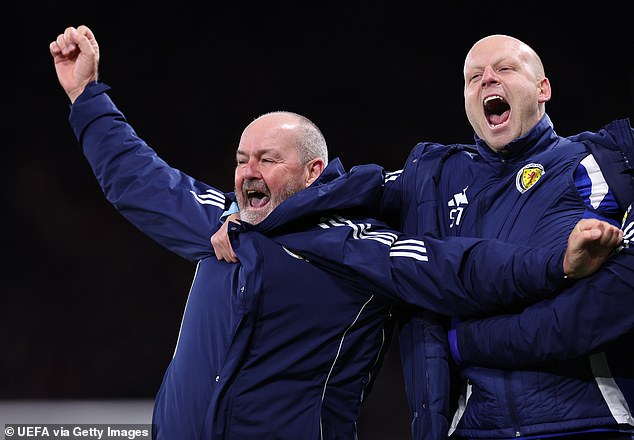 Clarke and assistant coach Steven Naismith join in with the joyous celebrations at Hampden