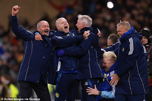 The celebrations go into overdrive for Clarke and staff after 4-2 victory over Denmark
