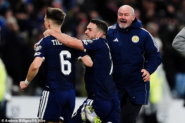 The joy of qualification is written all over Clarke's face as he rushes over to congratulate Tierney and McGinn
