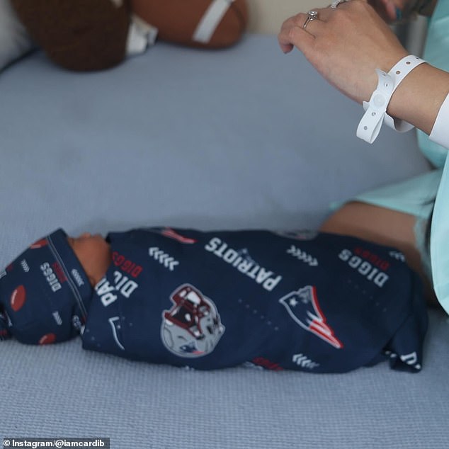 She captioned the post with the birthdate - November 4 - along with a teddy bear, grey heart, and football emojis