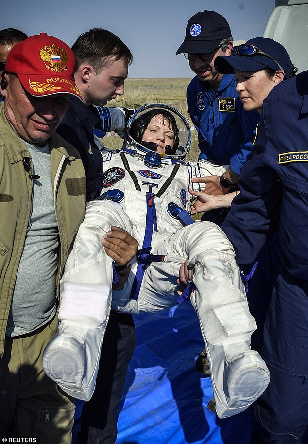 McClain seen being picked up by NASA ground personnel in Kazakhstan when she returned to Earth in 2019, following her ISS voyage where she accessed her ex-wife's bank account