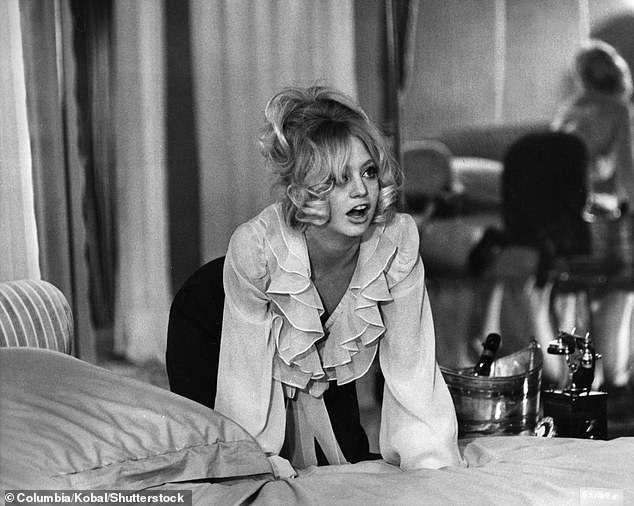 One of Goldie's beauty secrets is keeping her skincare routine simple and using the magic of her own hands (pictured in 1970)