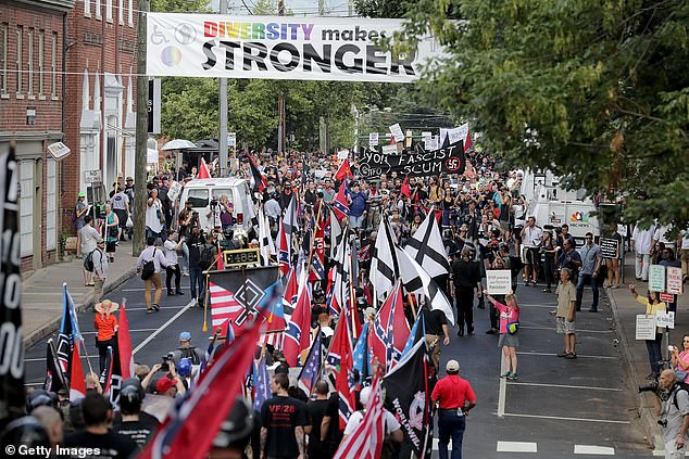 Hundreds of white nationalists, neo-Nazis and members of the 'alt-right' are seen marching in Charlottesville, Virginia in August 2017, after the town decided to remove a statue of Confederate General Robert E. Lee