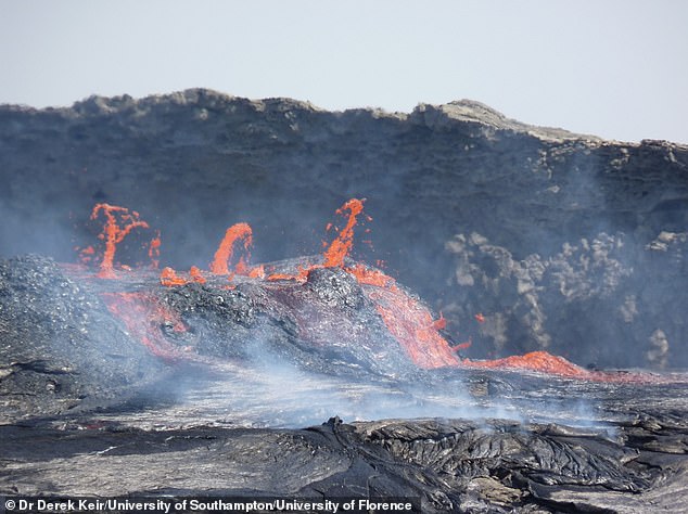 Scientists say a massive crack has started ripping through Africa, from the north east to the south, starting at the Afar region in Ethiopia. Pictured, active lava flows spilling out of the Erta Ale volcano in Afar, Ethiopia