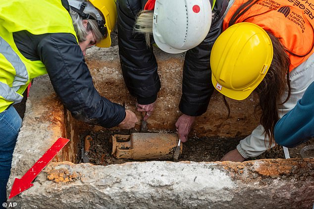 Archaeologists also found a bone hairpin, a piece of amber jewelry and traces of gold-threaded fabric. They said the size of the skeleton pointed to a young girl