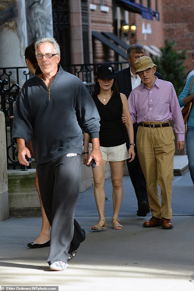 Filmmaker Woody Allen and his wife Soon-Yi Previn (pictured in the background, right), who were among guests in attendance, had a friendly relationship with Epstein (all three are pictured walking together in New York City in 2013)