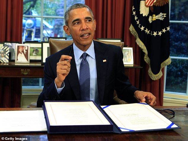 U.S. President Barack Obama signs the bipartisan budget bill 2015 into law in the Oval Office of the White House November 2, 2015 in Washington, DC