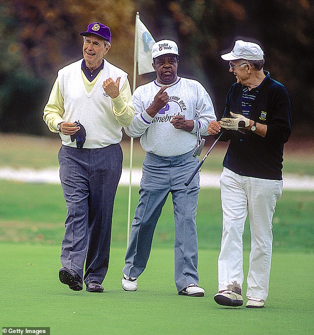 President HW Bush, left, plays golf with Pro Lee Elder and Admiral Frank Kelso