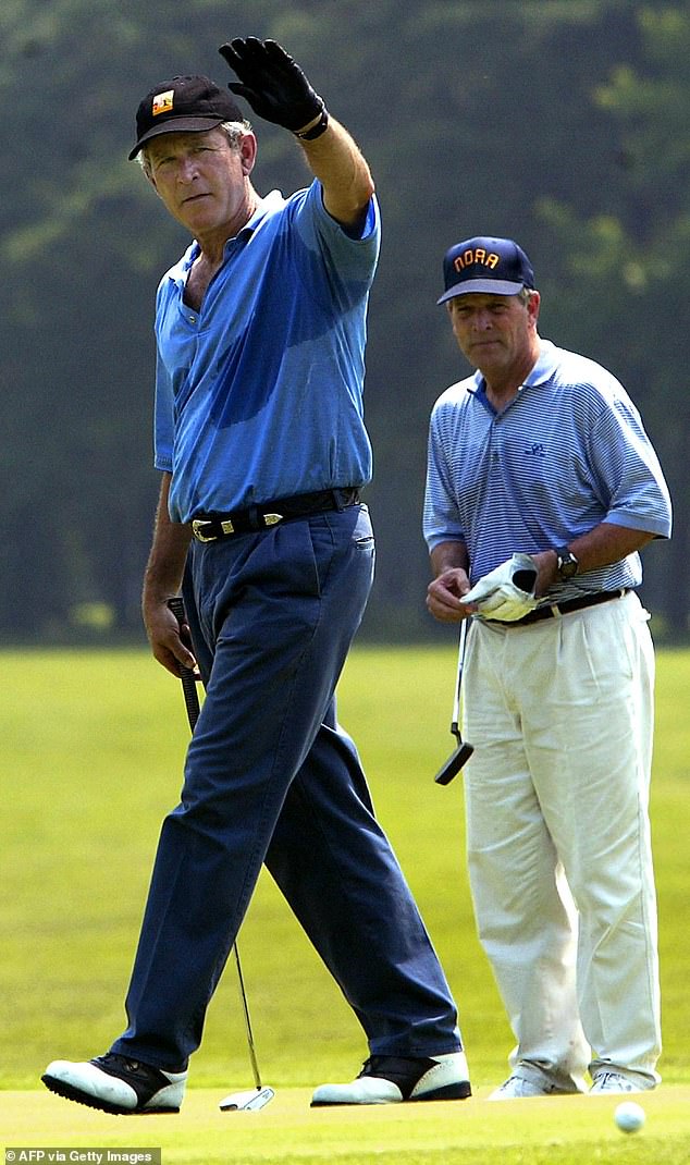 George W. Bush is seen finishing up a round of golf at Andrews Air Force Base in Maryland