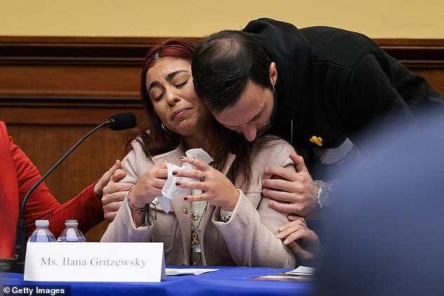 Ilana Gritzewsky is comforted after speaking about her experiences as a hostage during a discussion with the House Foreign Affairs Committee on February 12, 2025, in Washington