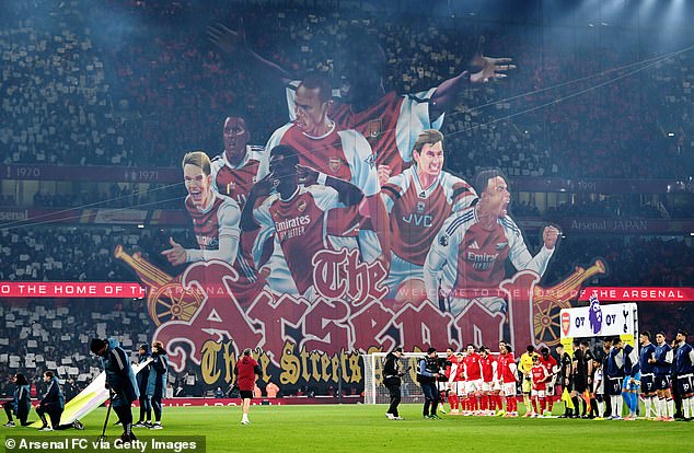 Sol Campbell, arms outstretched, was a standout feature of Arsenal's tifo against Tottenham