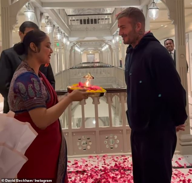 After a four hour visit to a local school, Beckham was greeted with a floral bouquet and accompanying aarti ritual, a Hindu ritual of worship