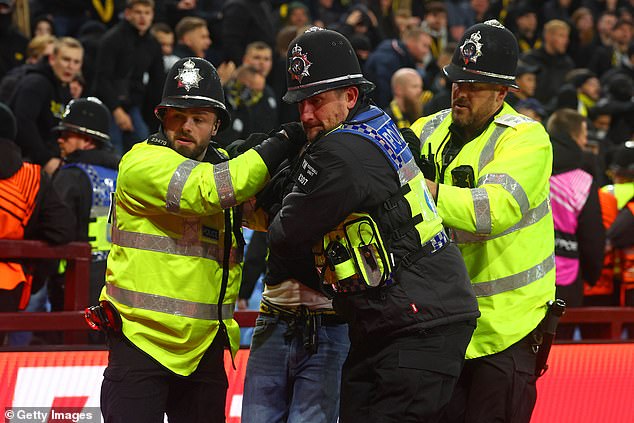 Fans were dragged from the stands in handcuffs amid shocking scenes of violence in Europe