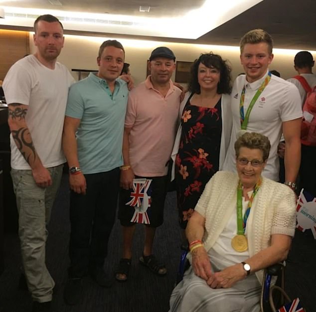 James Peaty, pictured second left alongside his brothers and parents, was arrested and held at his home in Uttoxeter, Staffs, on Monday and bailed