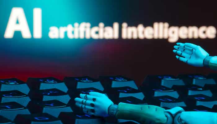 A message reading AI artificial intelligence, a keyboard, and robot hands are seen in this illustration.— Reuters