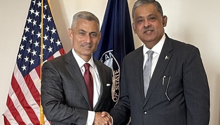US Assistant Secretary of State for South and Central Asian Affairs Paul Kapur (left) shakes hands with Pakistan’s Ambassador to the US, Rizwan Saeed Sheikh at the State Department in Washington DC, US, on November 7, 2025. —X/State_SCA
