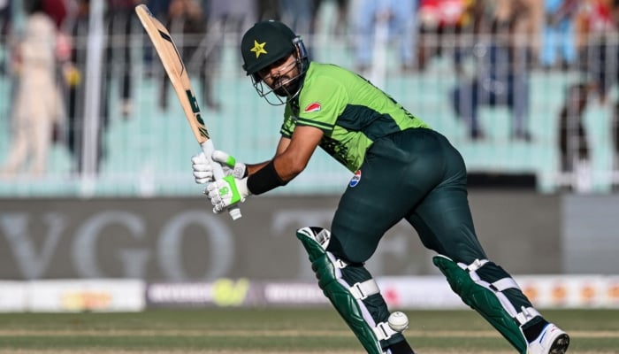 Pakistans Babar Azam plays a shot during the ODI cricket match against South Africa at the Iqbal Stadium in Faisalabad, November 6, 2025. — AFP