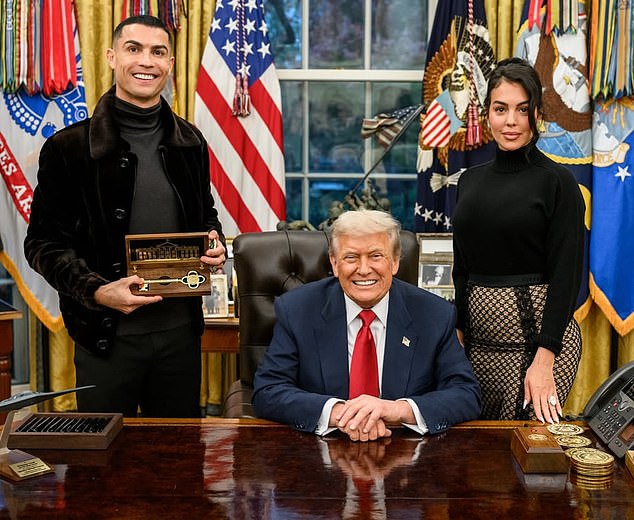 Cristiano Ronaldo and fiancee Georgina Rodriguez pose with Donald Trump in the Oval Office