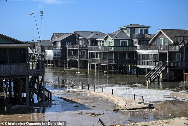 Condemned homes in Buxton, NC. Many choose to let the homes surrender to the sea, because moving them can be upwards of $350,000