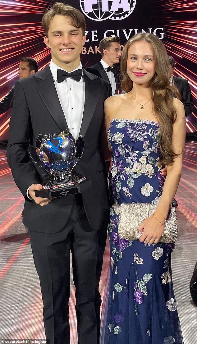 Australian fast food chain Grill'd has apologised for putting a 'curse' on Oscar Piastri (pictured with girlfriend Lily Zneimer) as his F1 title hopes appear to be fading fast