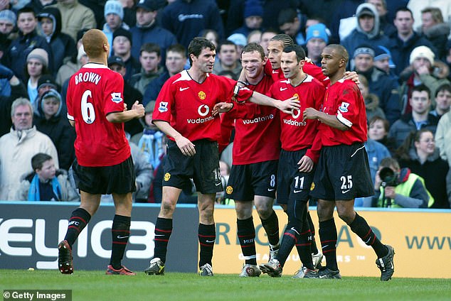 Former Man United star Quinton Fortune (right) shocked fans when he appeared as an assistant for Serbia against England