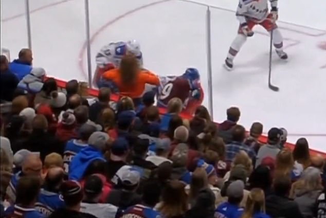 A female fan along the glass at an Avalanche-Rangers game lifted up her shirt on Thursday