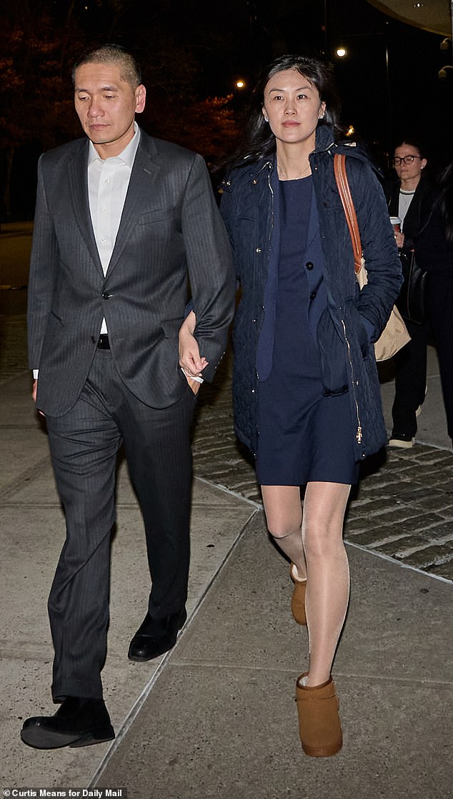 Former New York State aide Linda Sun, 41, and her husband, Chris Hu, 42, face trial on charges she was discretely supporting China's agenda in the state. They are pictured leaving Brooklyn Federal Court on Wednesday