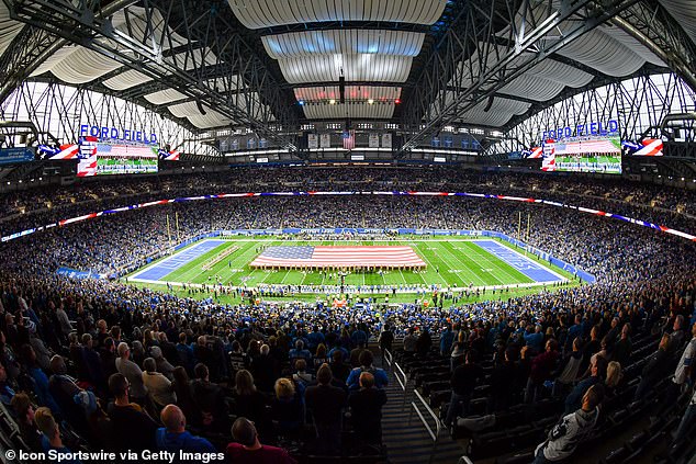 Ford Field and the Detroit Lions display a large United States Flag on the field during the National Anthem to honor Veterans following Veterans Day ceremonies in 2019