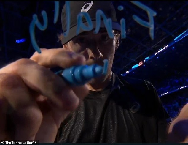 Aussie Alex de Minaur signs the camera after his win over Taylor Fritz at the ATP Finals