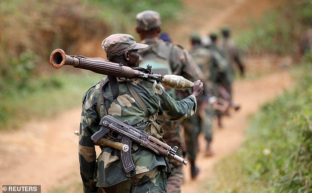 FILE PHOTO: Democratic Republic of Congo military personnel (FARDC) patrol against the Allied Democratic Forces (ADF) in 2013