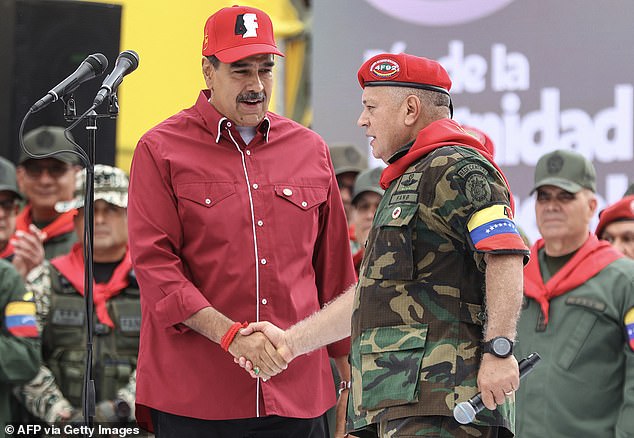 Venezuelan President Nicolas Maduro (left) greets his Interior Minister Diosdado Cabello Rondón (right), one of the power brokers who could potentially turn on his boss