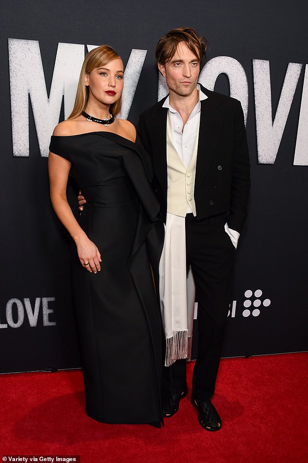 The duo matched in black, with Lawrence looking spectacular in an off-shoulder gown with a sizzling thigh-high slit