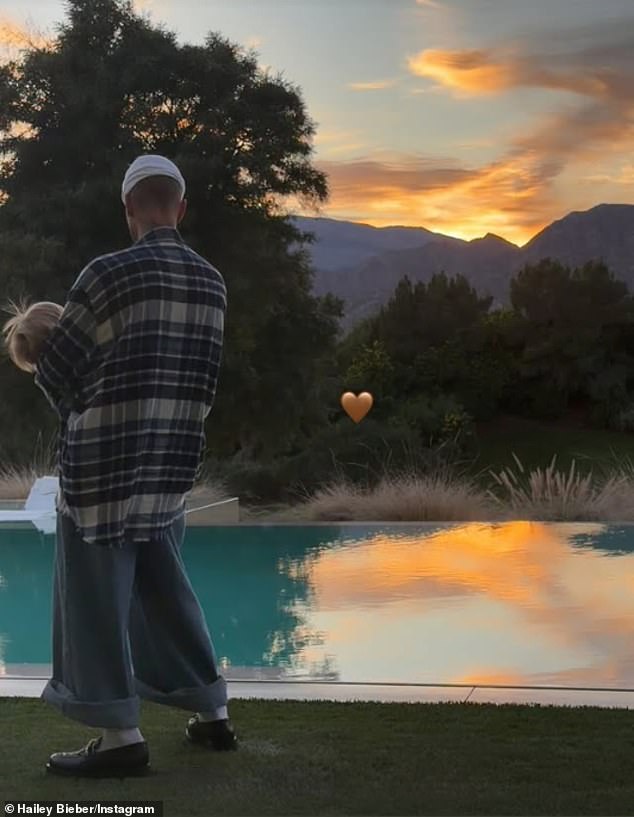Bieber's wife Hailey Baldwin Bieber also captured a sweet portrait of him cradling their 15-month-old toddler during the quiet family celebration