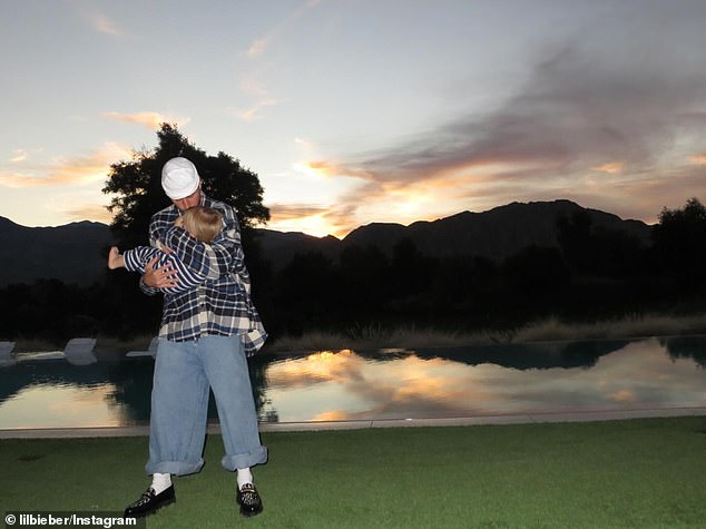 Justin Bieber kissed his mini-me son Jack Blues while poolside at his $16.6 million seven-bedroom mansion located inside The Madison Club in La Quinta, California on Thursday