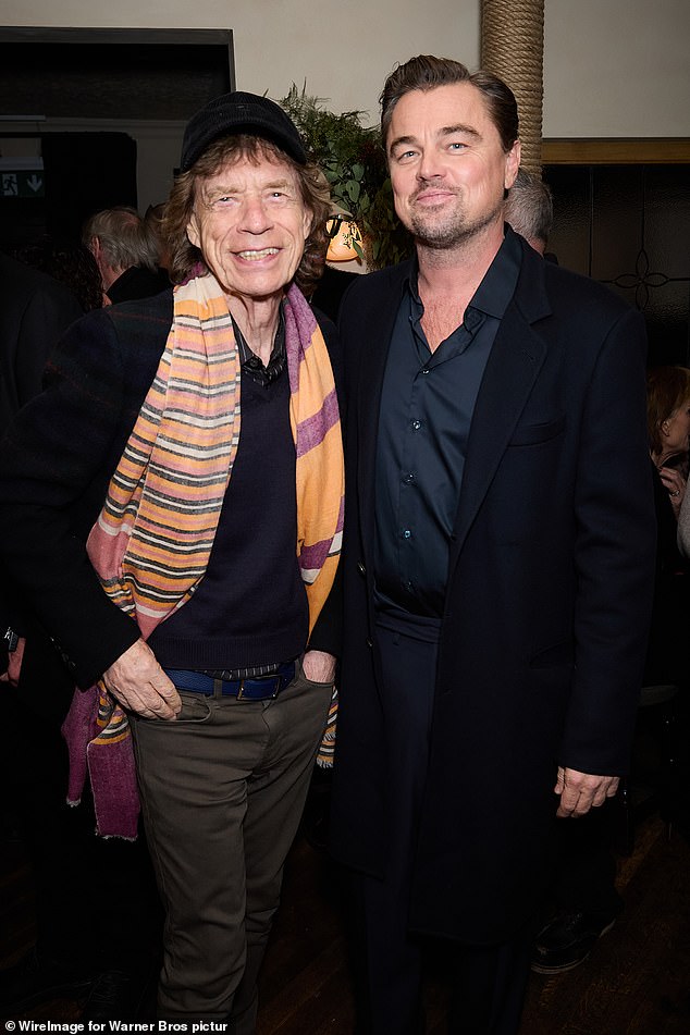 Leonardo DiCaprio rubbed shoulders with Sir Mick Jagger as the pair beamed in snaps as he celebrated his latest film One Battle After Another at The Hart Pub in London on Thursday