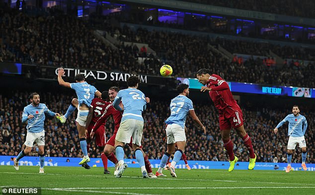 Virgil van Dijk (right) saw this first-half header ruled out during Liverpool's loss at Man City