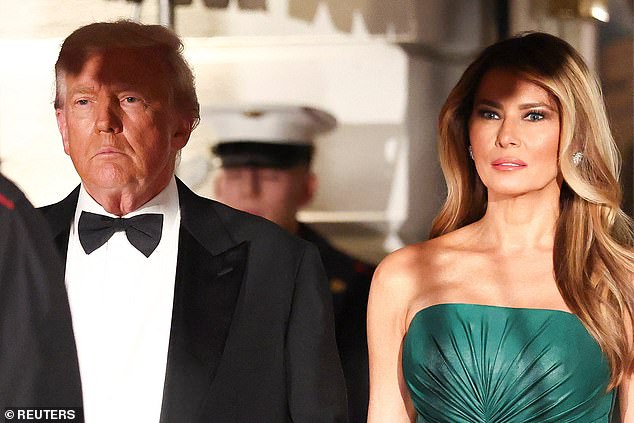 President Donald Trump (left) and First Lady Melania Trump (right) wait for the arrival of Saudi Crown Prince Mohammed bin Salman for a dinner in the East Room Tuesday night at the White House