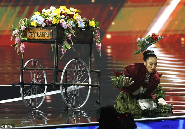 Miss Great Britain stunned audiences after falling flat on her face during the Miss Universe 2025 national costume competition in Thailand. Footage shows Danielle Latimer, 36, stepping onto the stage wearing a look inspired by Eliza Doolittle