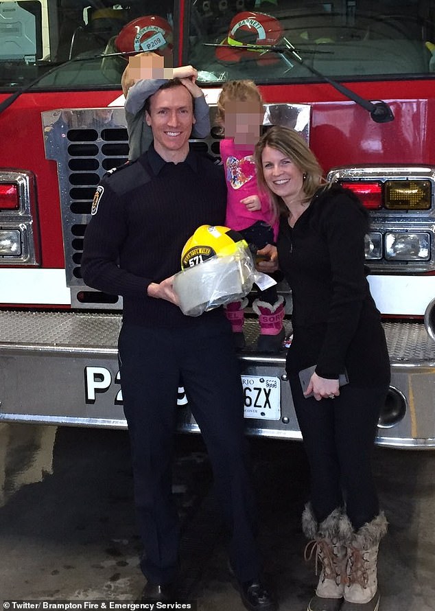 Ashley and James Schwalm are pictured with their two young children - ages six and nine - at the firehouse where James served as captain of the Brampton Fire Department