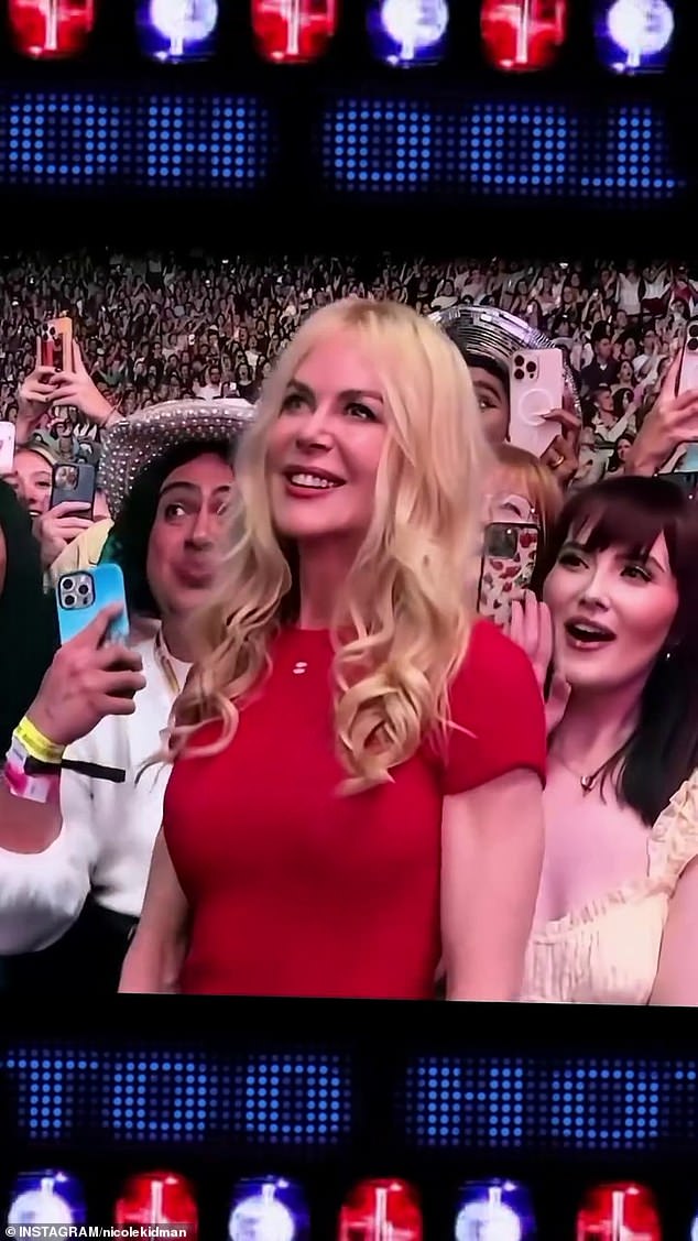 Clips from the concert show Kidman was standing just in front of the front row barrier wearing a vibrant red T-shirt and jeans